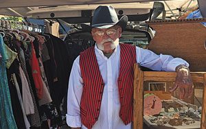 Man in vest and cowboy hat