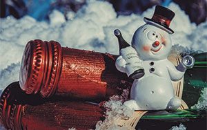 wine bottles with toy snowman