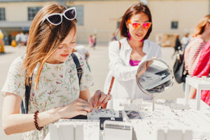 woman buying jewelry at flea market